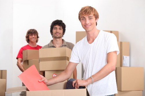 Professional flat removals Holborn team navigating a busy street and building access